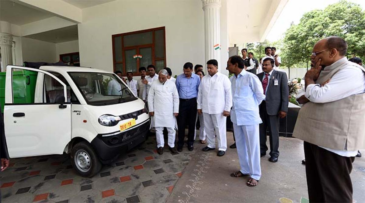 Chief Minister K Chandrashekar Rao inspecting the model of new auto trolley at his camp office at Begumpet in Hyderabad on Saturday. GHMC Commissioner Somesh Kumar, Rajya Sabha MP K Keshav Rao and others are also seen 